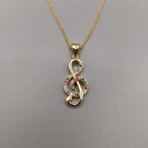 Nota musical sol fabricada en plata de ley 925 montada con circonitas multicolor engastadas